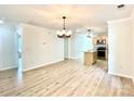 Bright and airy living room and kitchen with light wood floors, perfect for entertaining at 253 Hall Nw Ave, Concord, NC 28027
