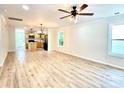 Bright and airy living room and kitchen with light wood floors, perfect for entertaining at 253 Hall Nw Ave, Concord, NC 28027