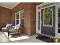 Cozy front porch with comfortable seating, perfect for relaxing and enjoying the outdoors at 2812 Julian Glen Cir, Waxhaw, NC 28173