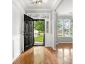 Bright foyer with hardwood floors, decorative transom window, and view into the front yard at 3038 Sterling Ct, Fort Mill, SC 29707