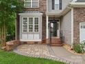 Charming front entrance featuring brick steps, stone accents, and a decorative window for added curb appeal at 3038 Sterling Ct, Fort Mill, SC 29707