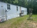 Home exterior with a small porch and a satellite dish at 3234 Legend Rd, Lancaster, SC 29720