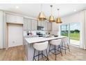 Modern kitchen with white countertops, gray cabinets, stainless steel appliances, and pendant lighting at 32562-B Millingport Rd # 7155, New London, NC 28127