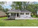 Charming, single-story home with a freshly painted white brick exterior and black trim at 330 Willow Oak Cir, Lancaster, SC 29720