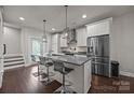 Modern kitchen showcasing a central island and stainless steel refrigerator at 336 Uptown West Dr, Charlotte, NC 28208