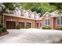 Brick home with three-car garage and expansive driveway at 3504 High Ridge Rd, Charlotte, NC 29270