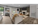 Cozy living room with a fireplace, neutral color palette, and stylish decor at 3528 Colony Rd # A, Charlotte, NC 28211
