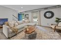 Bright and inviting living room featuring stylish furniture and ample natural light at 3528 Colony Rd # A, Charlotte, NC 28211