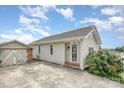 Cozy one-story house with light siding, along with a detached garage, and a beautifully paved driveway at 380 Woodlawn Ave, Cramerton, NC 28032