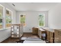 Bright, unfinished room with beautiful hardwood floors and large windows at 4315 Palm Dr, Denver, NC 28037