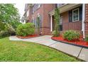 A beautifully landscaped walkway with colorful mulch leading to a brick home at 5004 Woodview Ln, Matthews, NC 28104