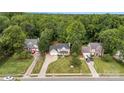 Aerial view of neighborhood featuring landscaped lawns and mature trees at 5625 Linda Vista Ln, Charlotte, NC 28216