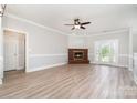 Inviting living room with fireplace, wood floors, and French doors leading to the backyard at 6201 New Hope Church Rd, Marshville, NC 28103