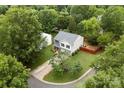 Aerial view of a two-story home with well-maintained yard surrounded by lush greenery in a peaceful neighborhood at 641 Saratoga Dr, Clover, SC 29710