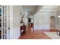 Elegant entryway featuring hardwood floors, arched doorways, and decorative trim at 8605 Soaring Eagle Ln, Waxhaw, NC 28173