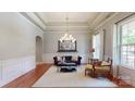 Bright living room with trey ceilings, large windows, and stylish furniture at 8605 Soaring Eagle Ln, Waxhaw, NC 28173