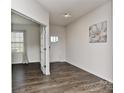 Bright entryway featuring hardwood floors, white walls, and an adjacent room with natural light at 9505 Cotswood Pl, Gastonia, NC 28056