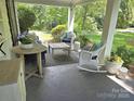 Inviting covered front porch with comfortable seating and stylish outdoor decor creating a cozy atmosphere at 1051 14Th Avenue Nw Dr, Hickory, NC 28601