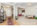 Inviting living space with hardwood floors, neutral walls, and abundant natural light at 12822 Plumleaf Dr, Charlotte, NC 28213