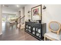 Inviting entryway featuring dark hardwood floors, a buffet table and stairway at 13338 Blanton Dr, Huntersville, NC 28078