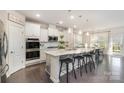 Bright kitchen with stainless steel appliances, quartz countertop, and island seating at 13338 Blanton Dr, Huntersville, NC 28078