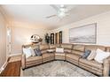Inviting living room featuring a comfortable leather sectional, modern fan and stylish decor at 1571 10Th Street Nw Pl, Hickory, NC 28601