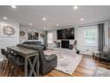 Open-concept living room featuring a brick fireplace and lots of natural light at 1761 Arden Dr, Lincolnton, NC 28092