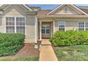 Charming townhome entrance with well-kept landscaping and a welcoming covered entryway at 1890 Sandal Brook Rd, Fort Mill, SC 29707