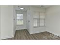 Bright, airy living room with new hardwood flooring, lots of light and fresh paint at 1890 Sandal Brook Rd, Fort Mill, SC 29707