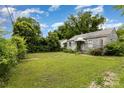 View of front yard with lush lawn needing cutting and light landscaping at 2308 Vanderbilt Rd, Charlotte, NC 28206