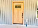 A close-up view of the exterior front door with a glass window at 251 Hall Nw Ave, Concord, NC 28027
