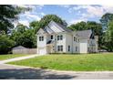 Charming two-story home with white siding, well-manicured lawn and attached garage at 3004 Marlowe Ave, Charlotte, NC 28208