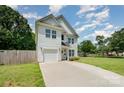 Charming two-story home with white siding, well-manicured lawn and attached garage at 3004 Marlowe Ave, Charlotte, NC 28208