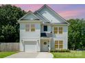 Charming two-story home with white siding, well-manicured lawn and attached garage at dusk at 3004 Marlowe Ave, Charlotte, NC 28208