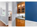Convenient Butler's pantry with a display cabinet at 6300 Latta Springs Cir, Huntersville, NC 28078