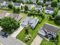 Aerial view of a suburban neighborhood with well-maintained homes and green lawns at 114 Nevis Ln, Mooresville, NC 28115