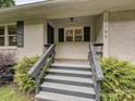 Inviting front porch with painted wooden steps leading to the door, providing a warm welcome at 136 Gable Rd, Mooresville, NC 28115