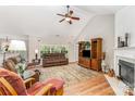Bright living room with vaulted ceilings, fireplace, and comfortable seating at 13830 Riding Hill Ave, Charlotte, NC 28213