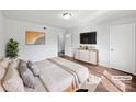 Serene main bedroom featuring a comfortable bed, modern decor, and ample natural light at 1908 Harvest Ln # 5, Charlotte, NC 28210