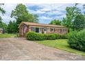 Traditional brick home with a well-maintained front yard, offering a welcoming and classic aesthetic at 3424 Autumn Dr, Gastonia, NC 28056