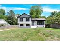Charming two-story home with white siding, black accents, and a well-manicured front yard at 6328 Beecher Dr, Charlotte, NC 28215