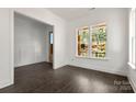 Bright living room with hardwood floors, large window and natural light at 6782 Kingfisher Ct, Denver, NC 28037