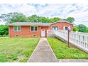 Classic brick home featuring a welcoming front entrance and accessible ramp at 800 Charles Rd, Shelby, NC 28150