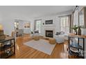 Cozy living room features a fireplace, hardwood floors, and elegant decor at 8441 Sandowne Ln, Huntersville, NC 28078