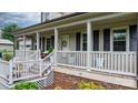 Close-up of the charming front porch, showcasing the welcoming entrance and decorative elements at 139 Pleasant Garden Dr, Taylorsville, NC 28681