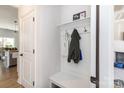 Mud room area with built-in storage and hanging hooks provides organization at 16018 River Tree Ln, Charlotte, NC 28278