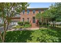 Charming brick two-story home featuring a well-manicured lawn and inviting front entrance at 16028 Cranleigh Dr, Huntersville, NC 28078
