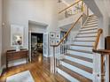 Bright foyer with staircase, hardwood floors, and views into other rooms at 16308 Woolwine Rd, Charlotte, NC 28278
