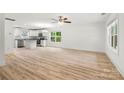 Bright and open living room featuring modern flooring and an abundance of natural light at 210 N Correll St, Landis, NC 28025