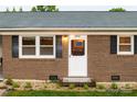 Close up on the front door, windows, and brick facade at 2212 10Th Ne Ave, Hickory, NC 28601